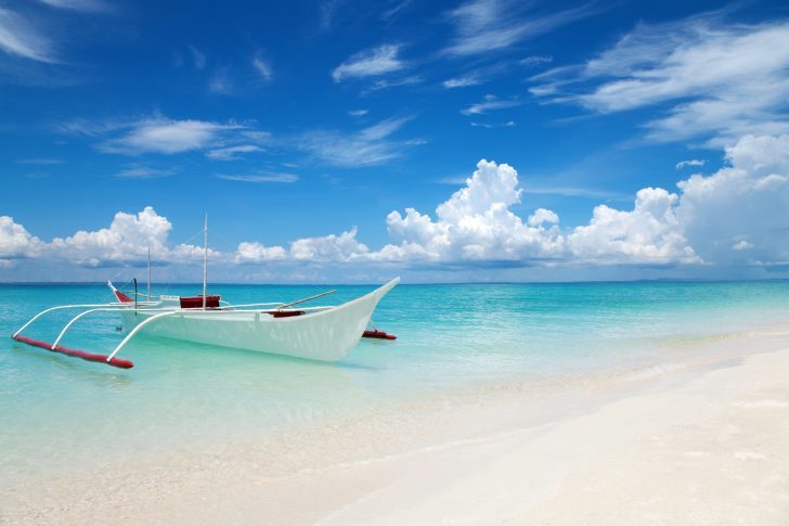 White boat on tropical Bantayan island in Philippines
